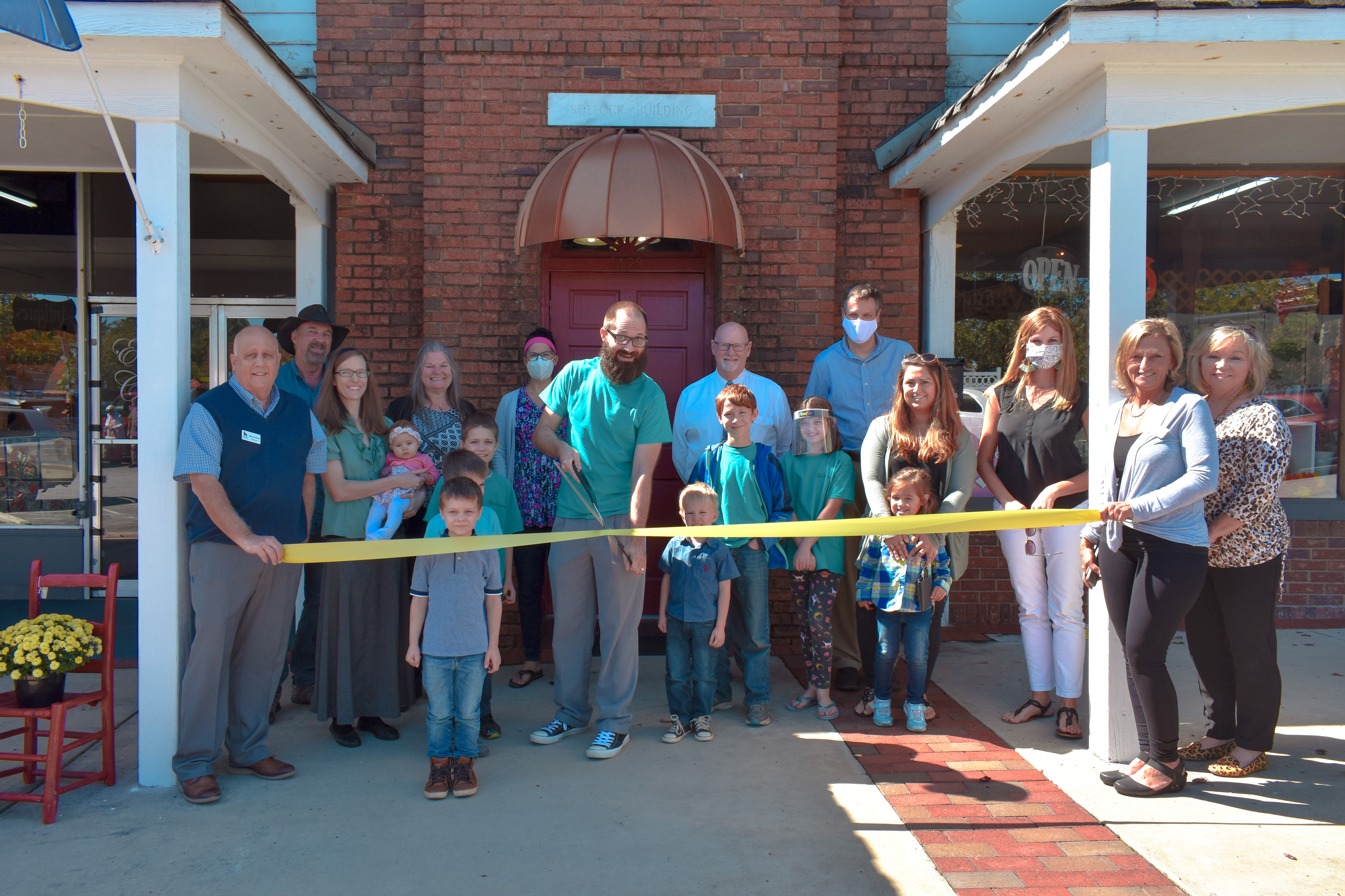 Headmaster David Justin Freeman cutting the ribbon at the opening of the School of Future Arts in Clarkesville Georgia